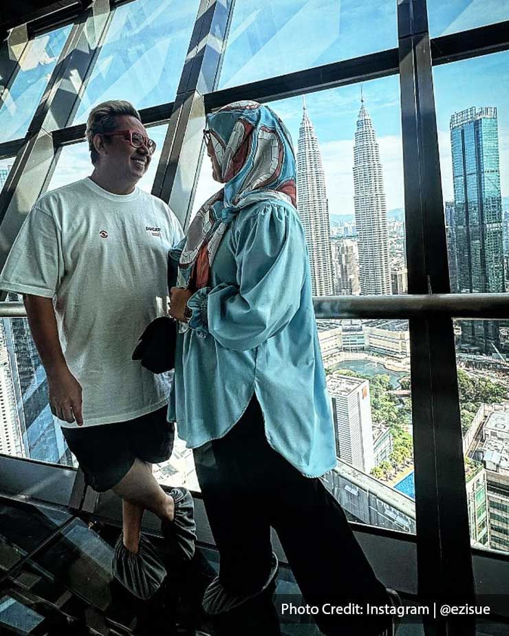 A couple posing against the city backdrop on a sunny day at Imperial Lexis Kuala Lumpur.