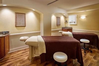 treatment room with two massage tables