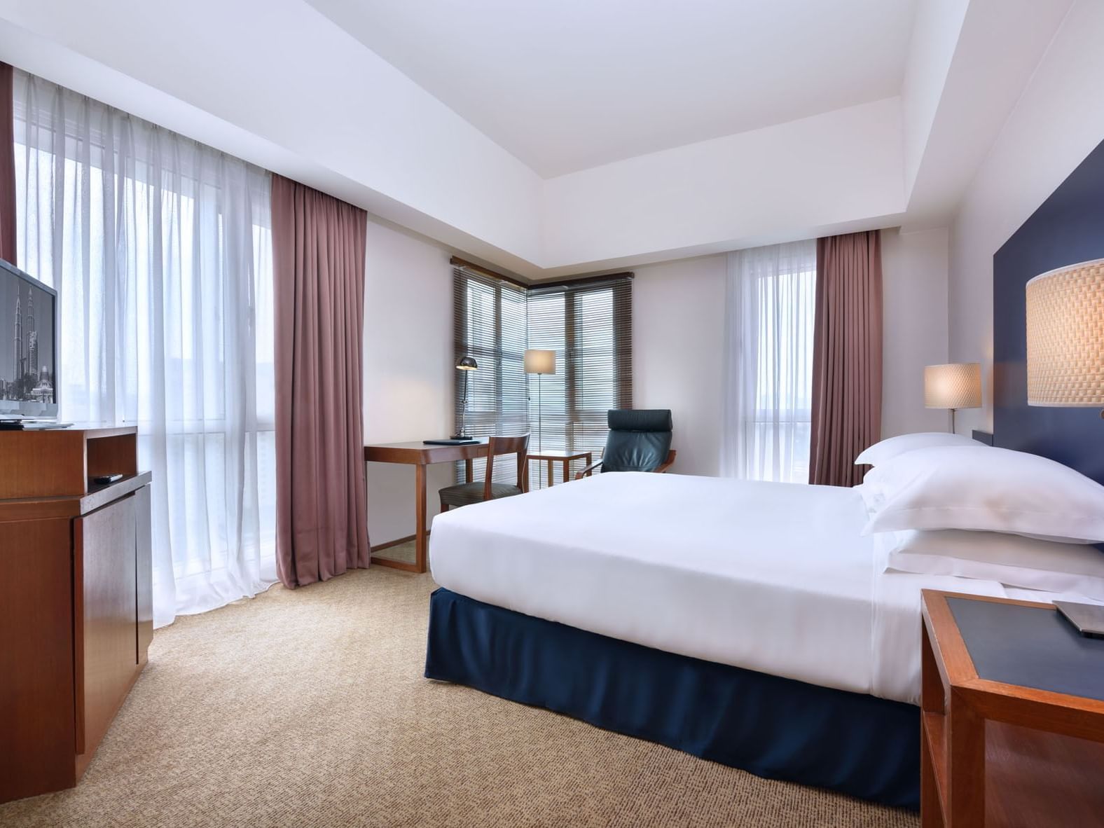 Interior of Premium Corner bedroom at Federal Hotels