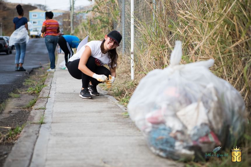 People collecting litter near True Blue Bay Resort