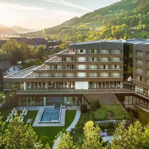 Aerial view of the hotel on a sunny day at Falkensteiner Hotel Schladming