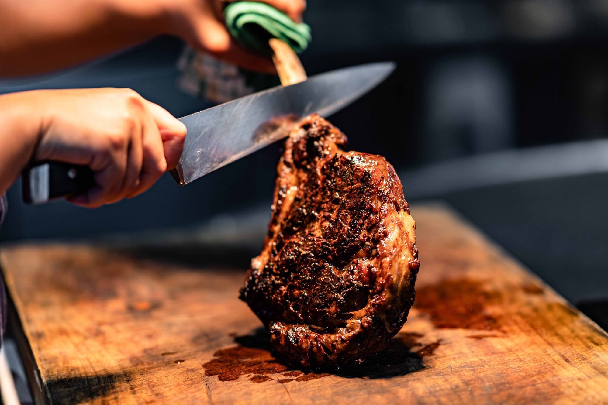 The Ternary - A person cutting meat