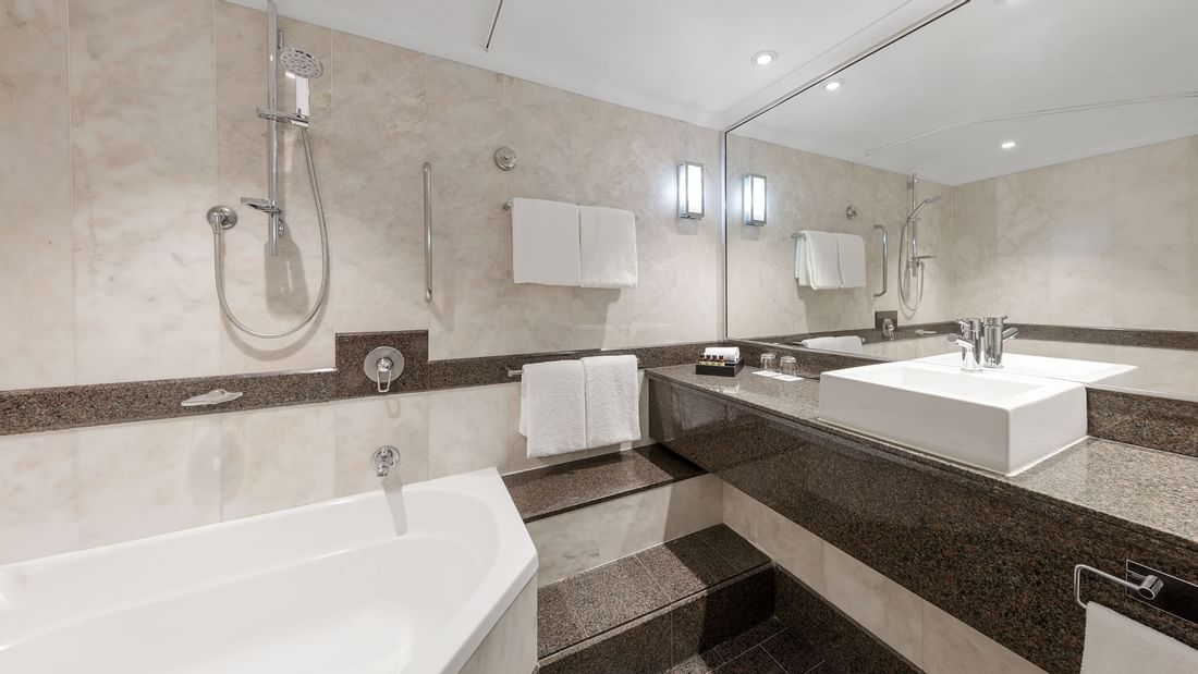 Vanity & bathtub in Deluxe Room Bathroom at Pullman Sydney Hyde Park