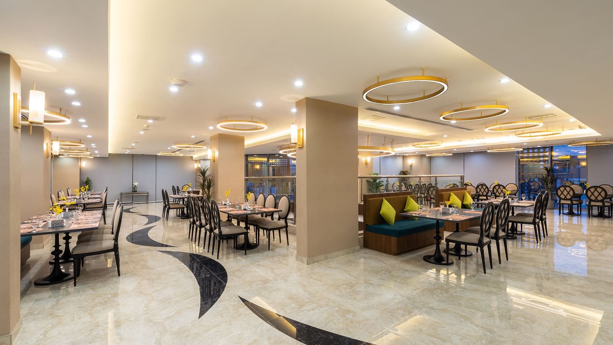 Elegant dining area featuring large dining tables in Al Meer Restaurant at Warwick Riyadh