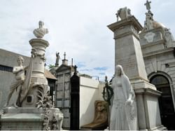 Statues by the Recoleta Cemetery entrance near Grand Hotels Lux