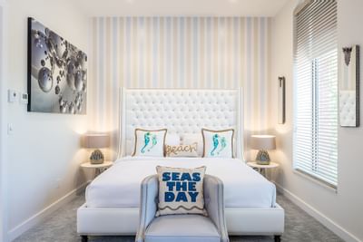 Bed with padded headboard & comfy pillows in King Premiere Palm at Retro Suites Hotel