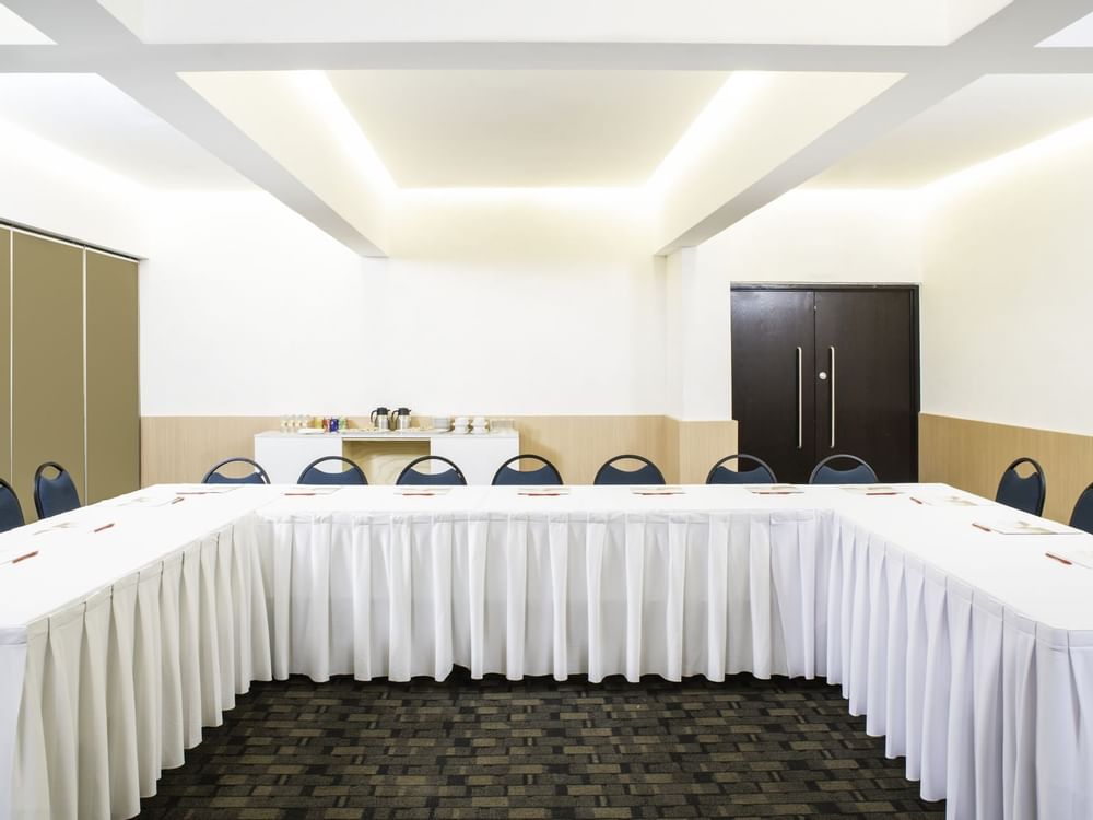 Front shot of U-style table set up in Salon D at Fiesta Inn