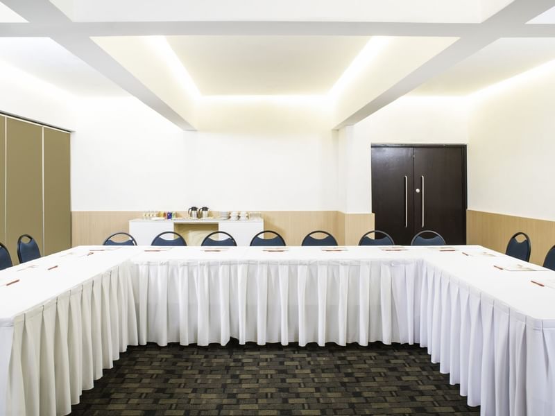 Front view of U-style table setup in Salones ABC at Fiesta Inn