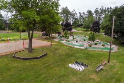 Aerial view of a park with mini-golf, playground and giant chess set in The Lodge in Schroon Lake