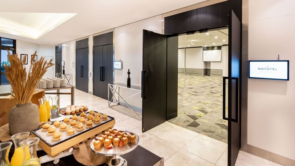 Snack and beverage station set up outside the Grand Ballroom at Novotel Sydney International Airport