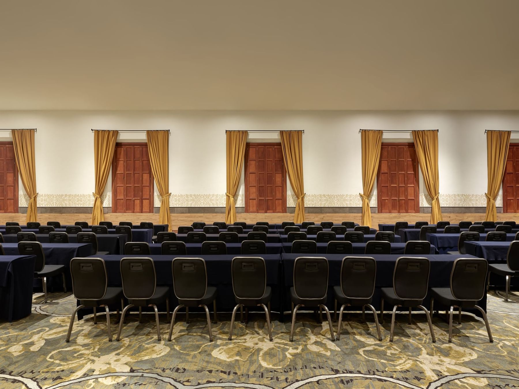 Rows of chairs arranged in meeting room at La Coleccion Resorts