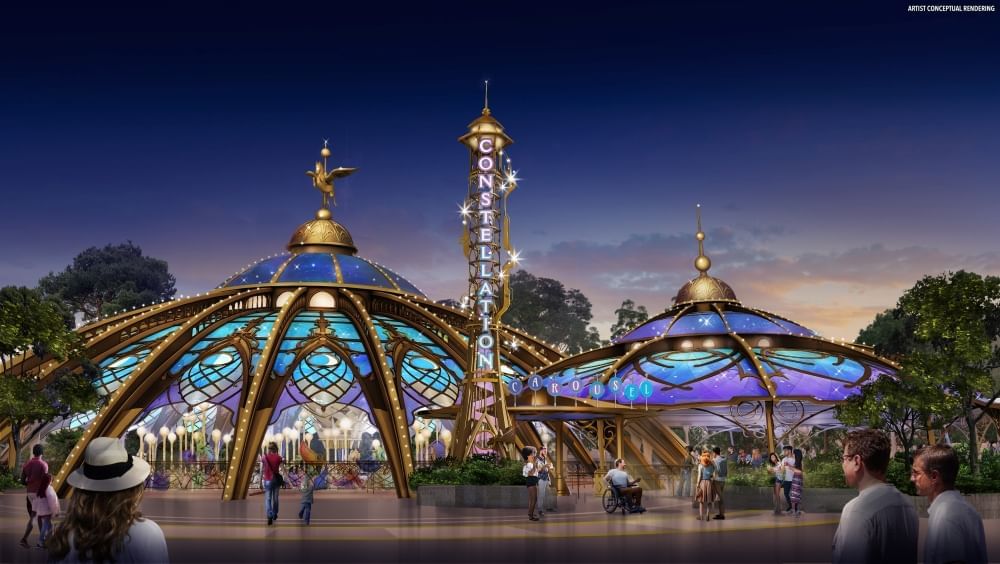 Two ornate glowing domes with stained glass-like panels in turquoise and purple with gold accents. A tall gold spire with the word "Constellation" sits between the two domes.