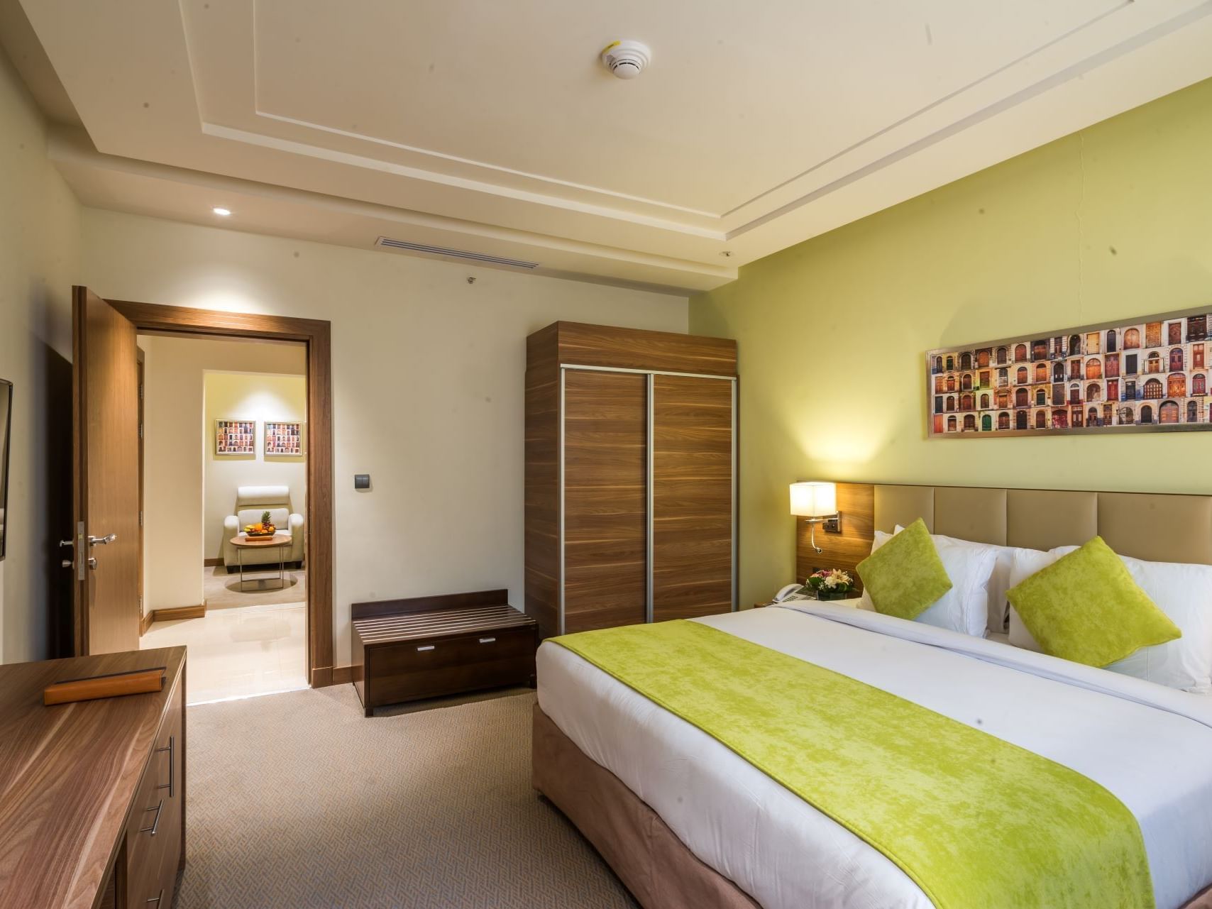 Interior of junior suite with a king bed at Mena Hotel Tabuk