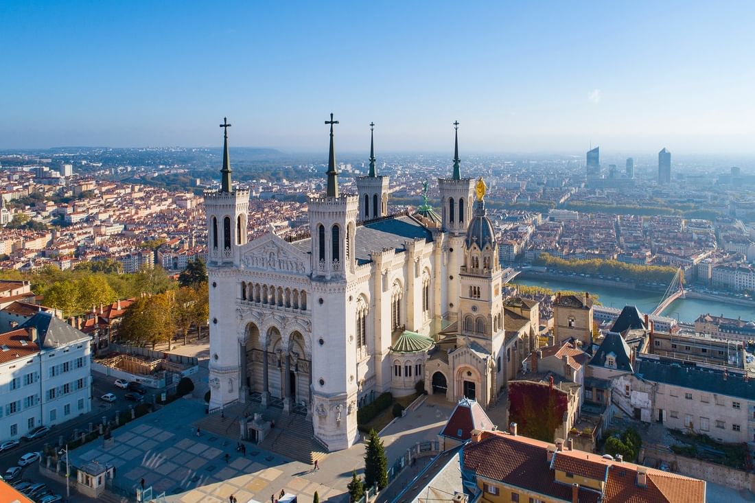 Aerial view of the Basilica of Notre-Dame de Fourvière and city skyline at Warwick Lyon