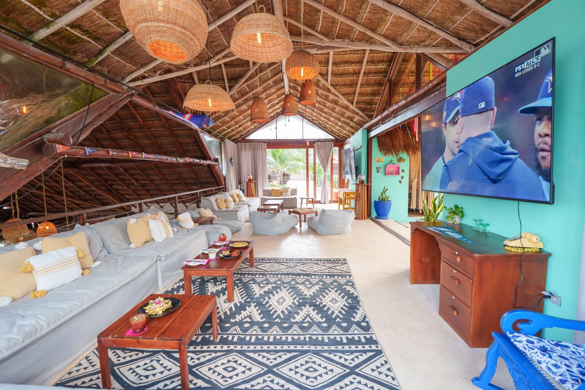 La Zebra Sports Bar with a large screen TV and comfortable seating at La Zebra Hotel