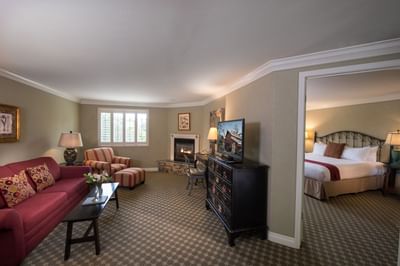 Deluxe Suite with view of master bedroom and living room with se
