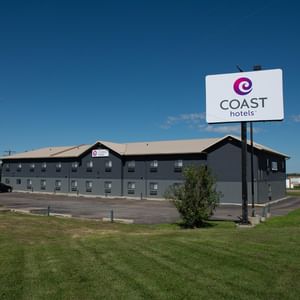 Coast Innisfail Hotel Exterior with hotel signage and sky in the background