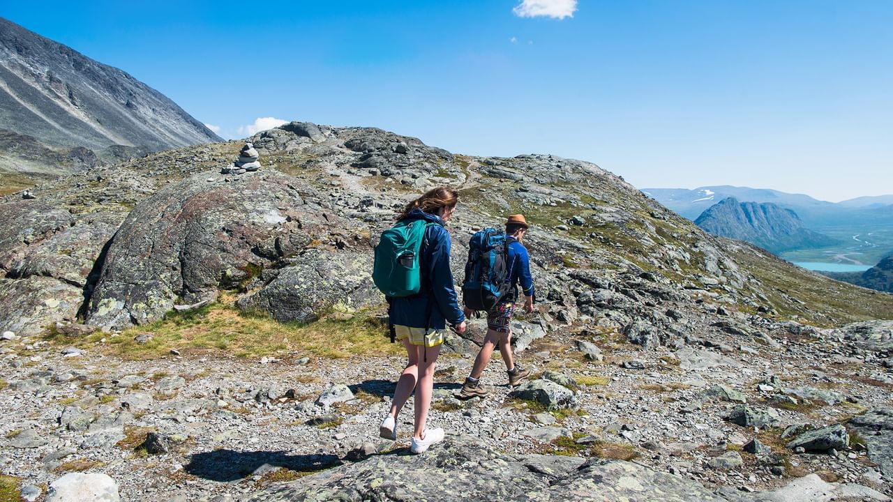 a group of hikers hiking on a mountain during a heli-hiking adventure