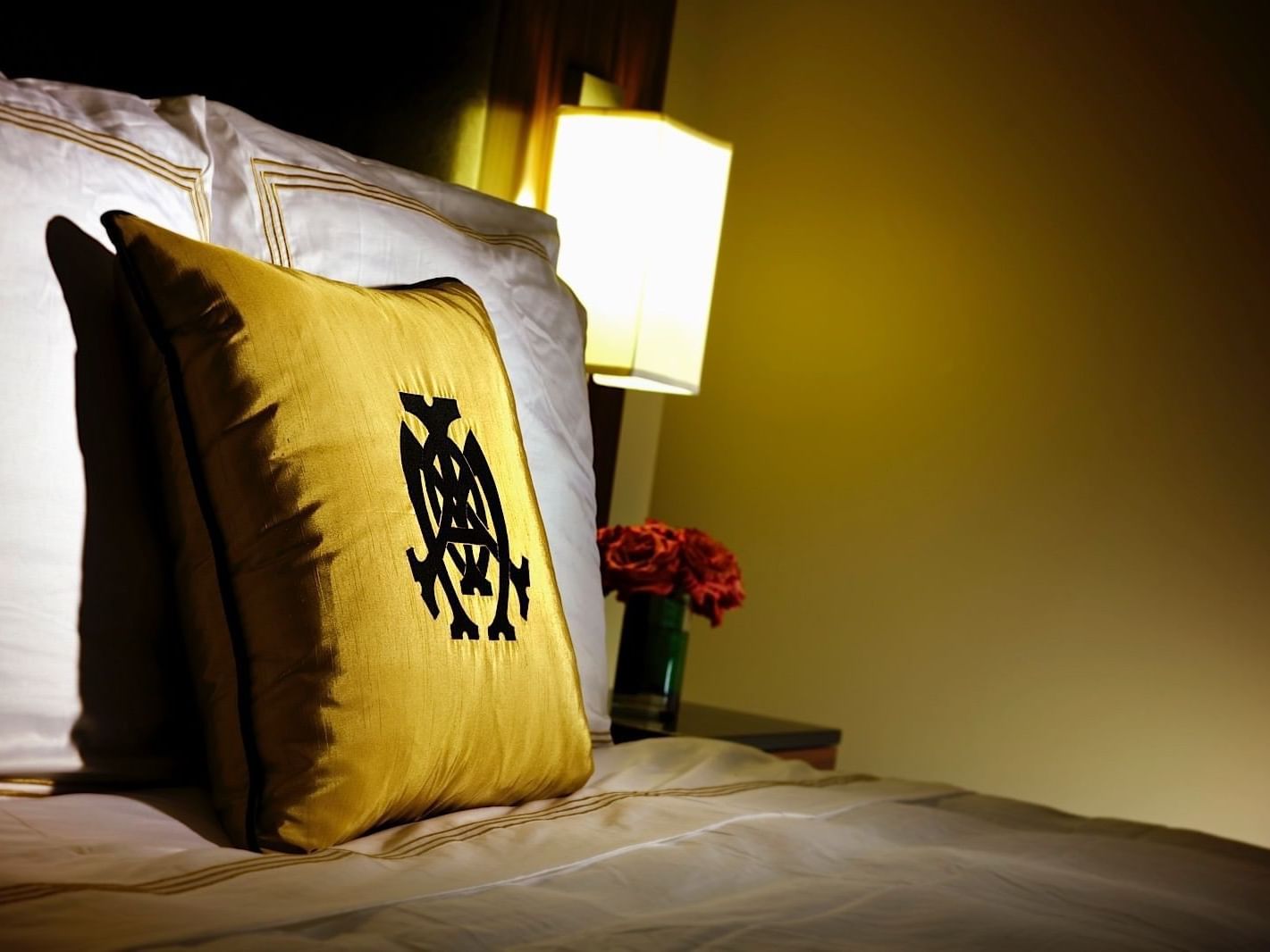 Close-up pillow on bed in Mayo Connector Suite at Mayo Hotel