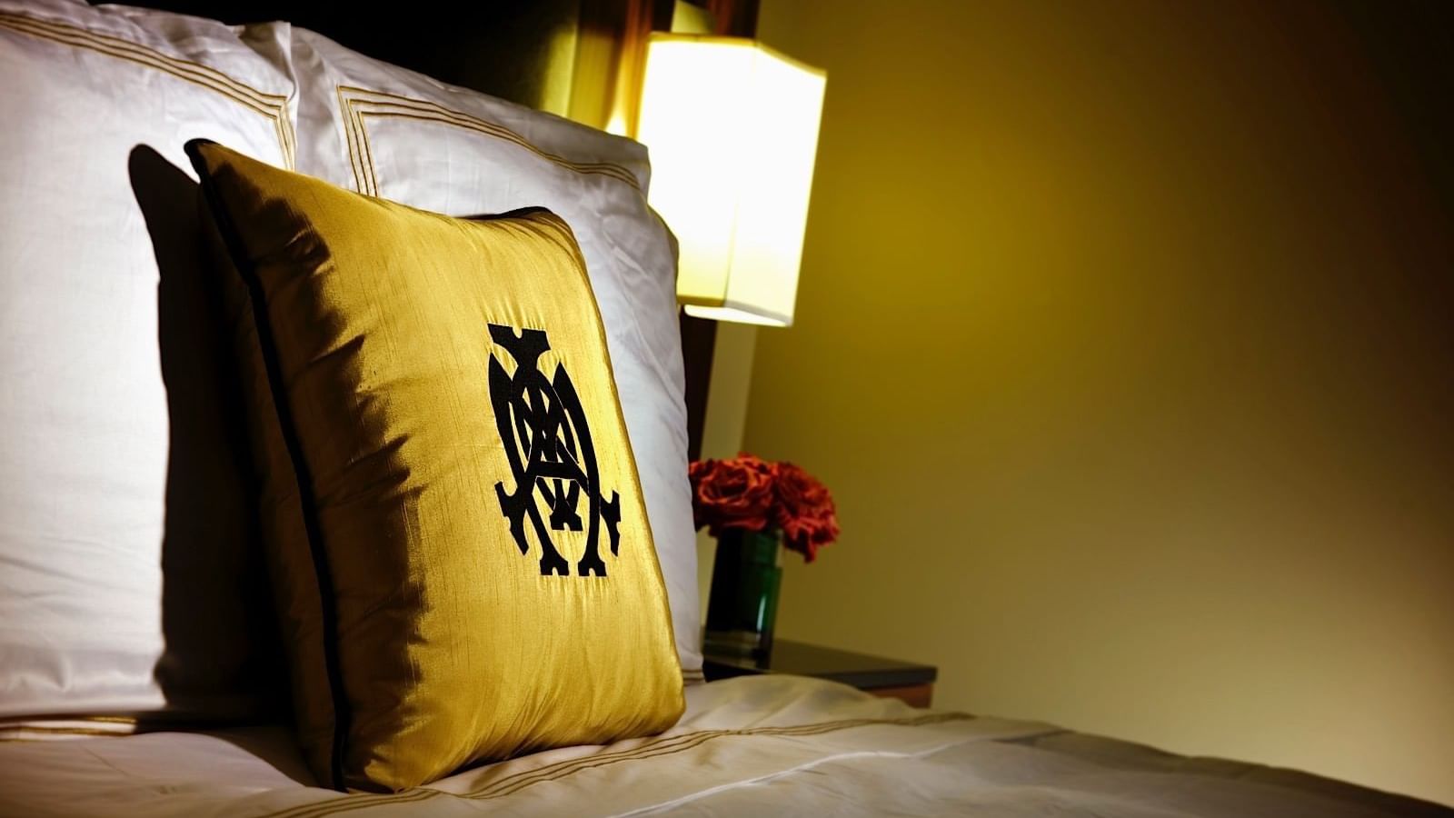 Close-up pillow on bed in Mayo Connector Suite, The Mayo Hotel