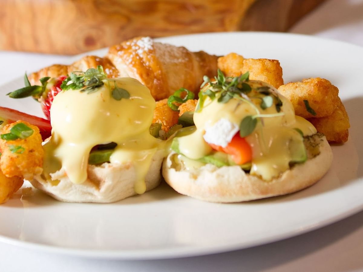 Salmon egg benedicts with tater tots and pastry