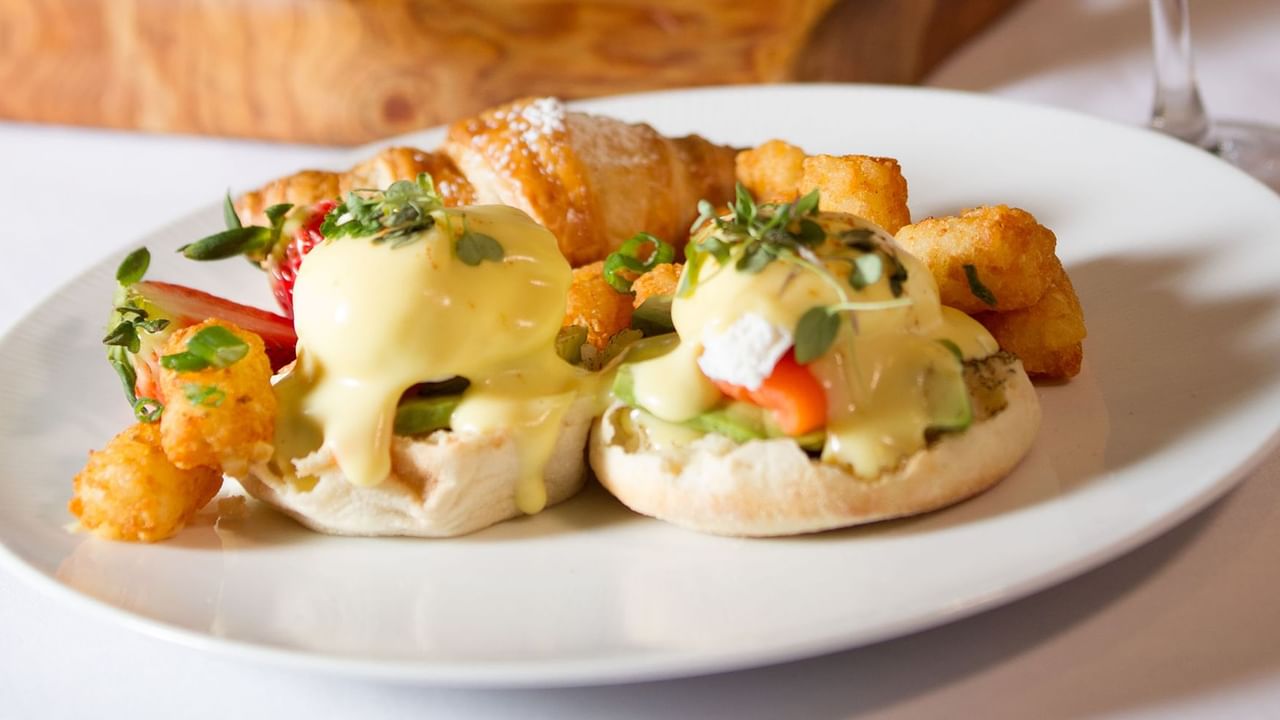 Salmon egg benedicts with tater tots and pastry