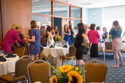 Portrait of guests enjoying an event at UMass Lowell Inn