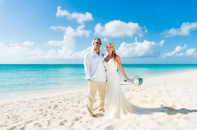 Wedding couple at the beach at The Somerset On Grace Bay