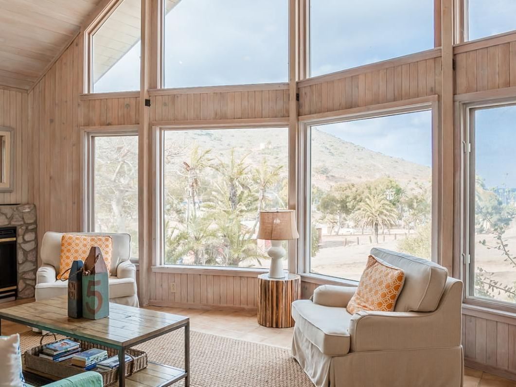 Living room featuring a large window and cozy sofa set up in Villa Santa Cruz at Banning House Lodge