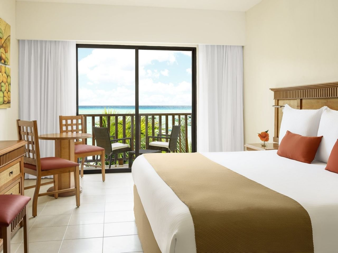 Bed in Premium Partial Ocean View Room at The Reef Coco Beach