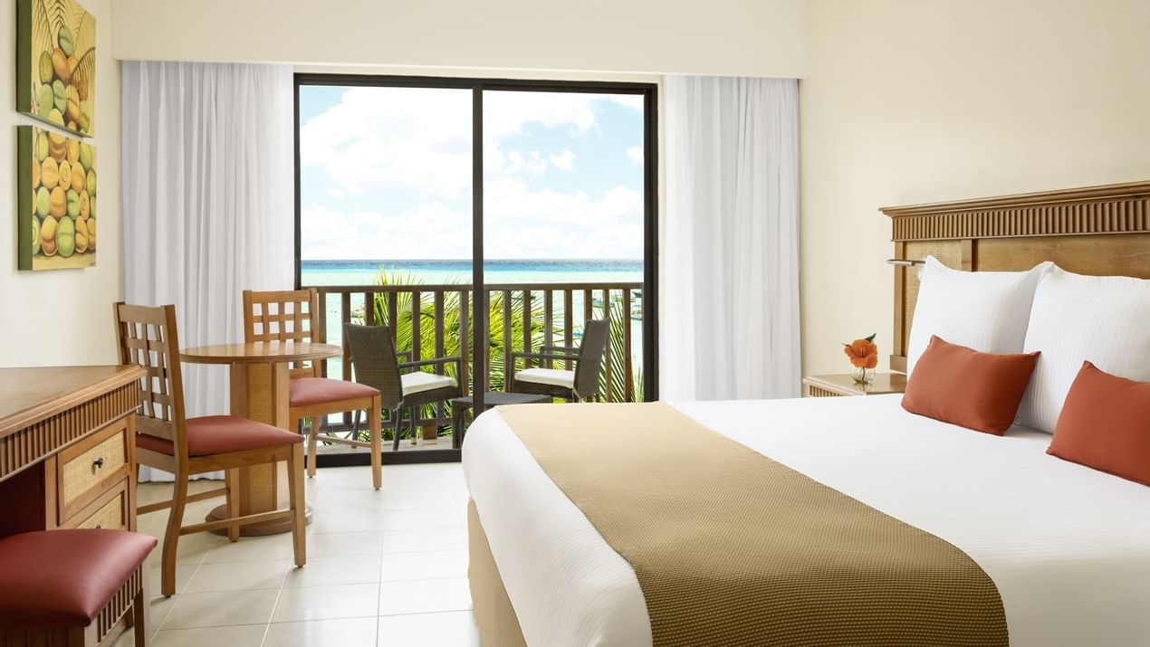 Bed in Premium Partial Ocean View Room at The Reef Coco Beach