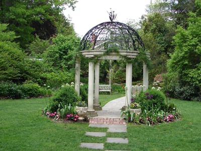 Garden gazebo surrounded by lush greenery at Hanoi Daewoo Hotel