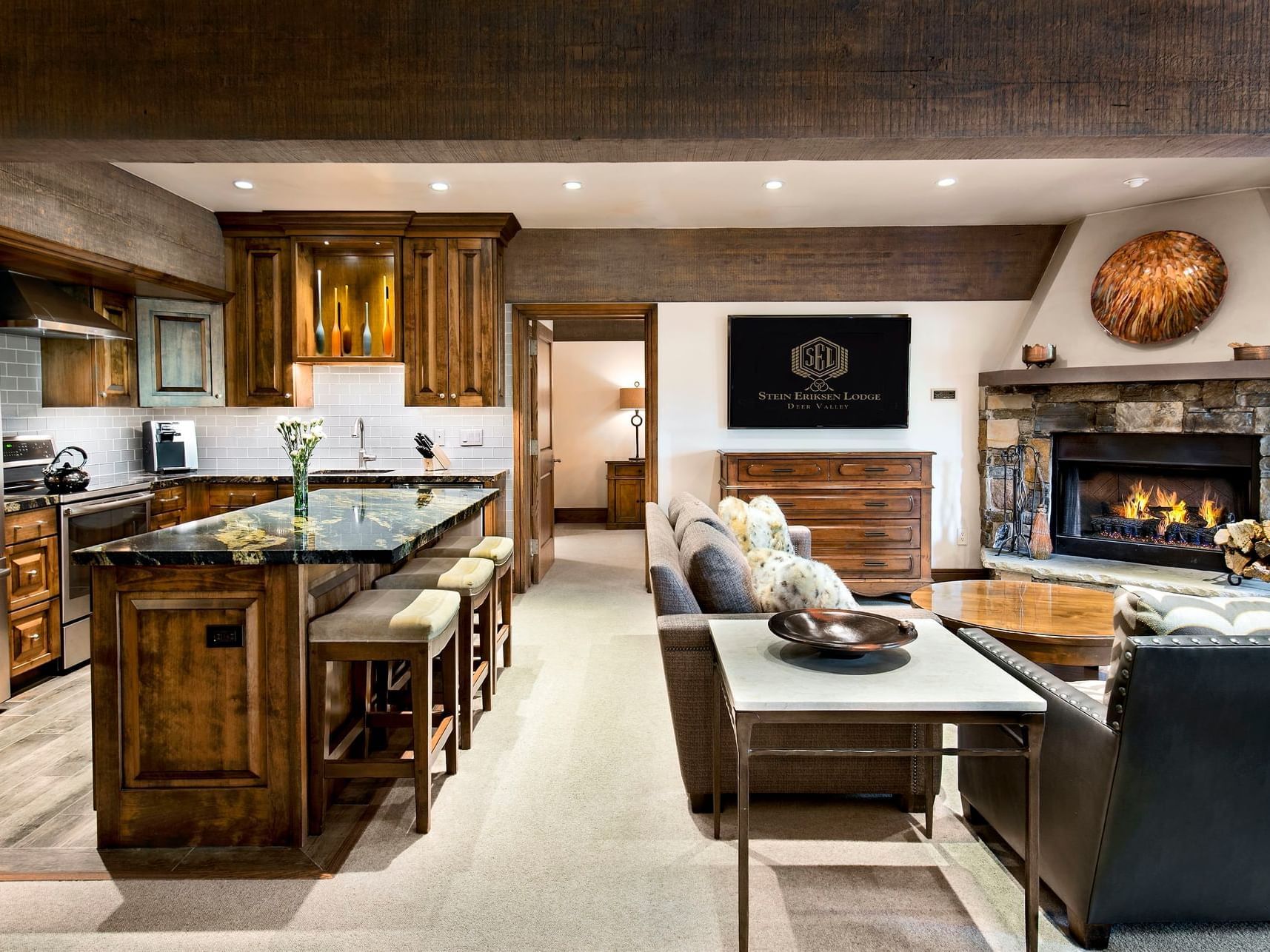 A kitchen & a living area at Luxury Suite in Stein Eriksen Lodge