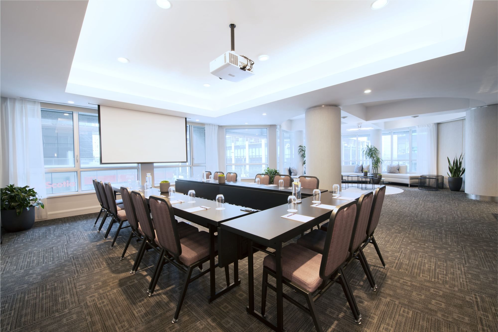 Salon De La Montagne with u-shaped table setup and lounge at Warwick Le Crystal