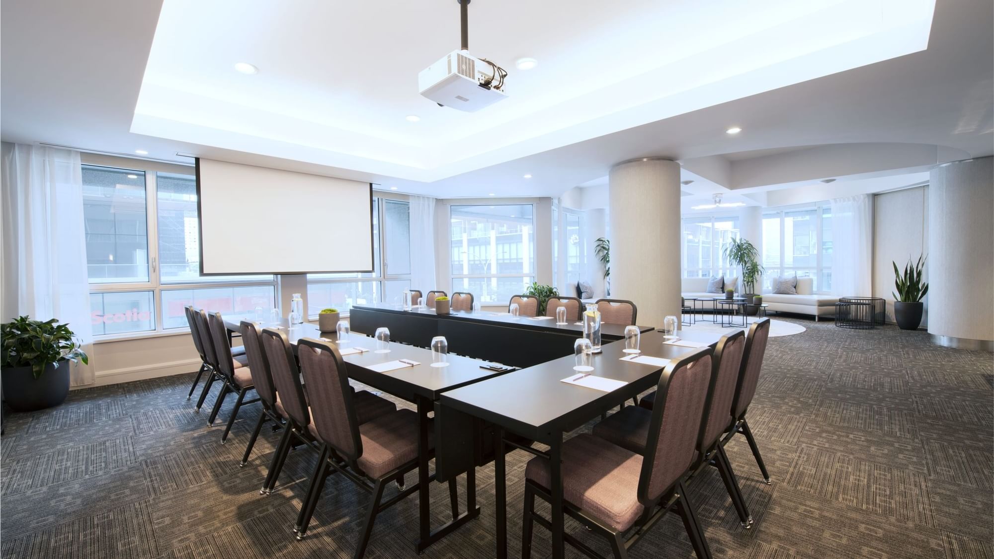 Salon De La Montagne with u-shaped table setup and lounge at Warwick Le Crystal