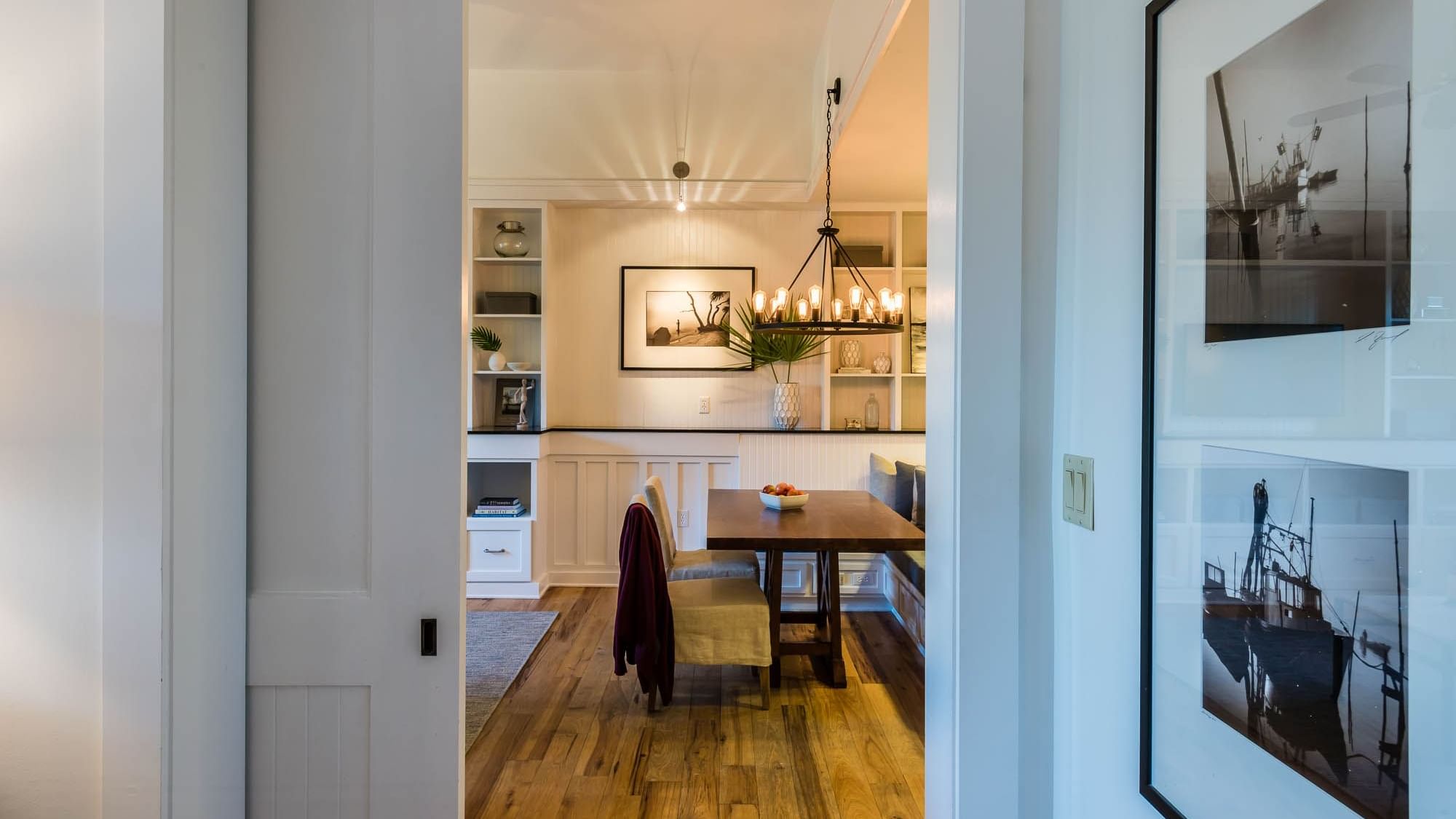 Dining area arrangement with a chandelier in Premium Resort Suite at Watersound Inn