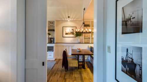 Dining area arrangement with a chandelier in Premium Resort Suite at Watersound Inn
