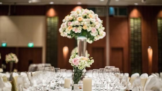 Closeup of flower decors on a banquet table at Amara Hotel