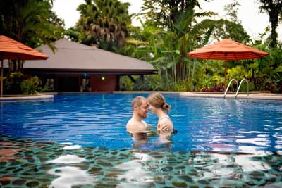Couple enjoying in the pool at Rio Celeste Hideaway