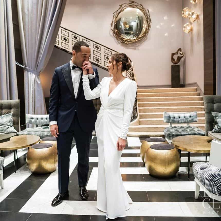 newlyweds in the historic lobby of the empire hotel