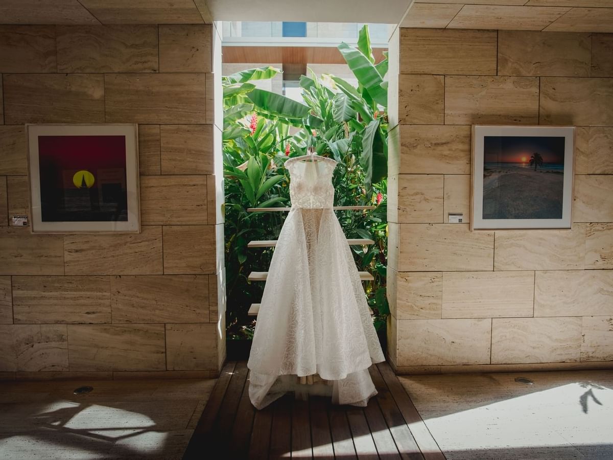 Wedding dress hanging in a room at the La Colección Resorts
