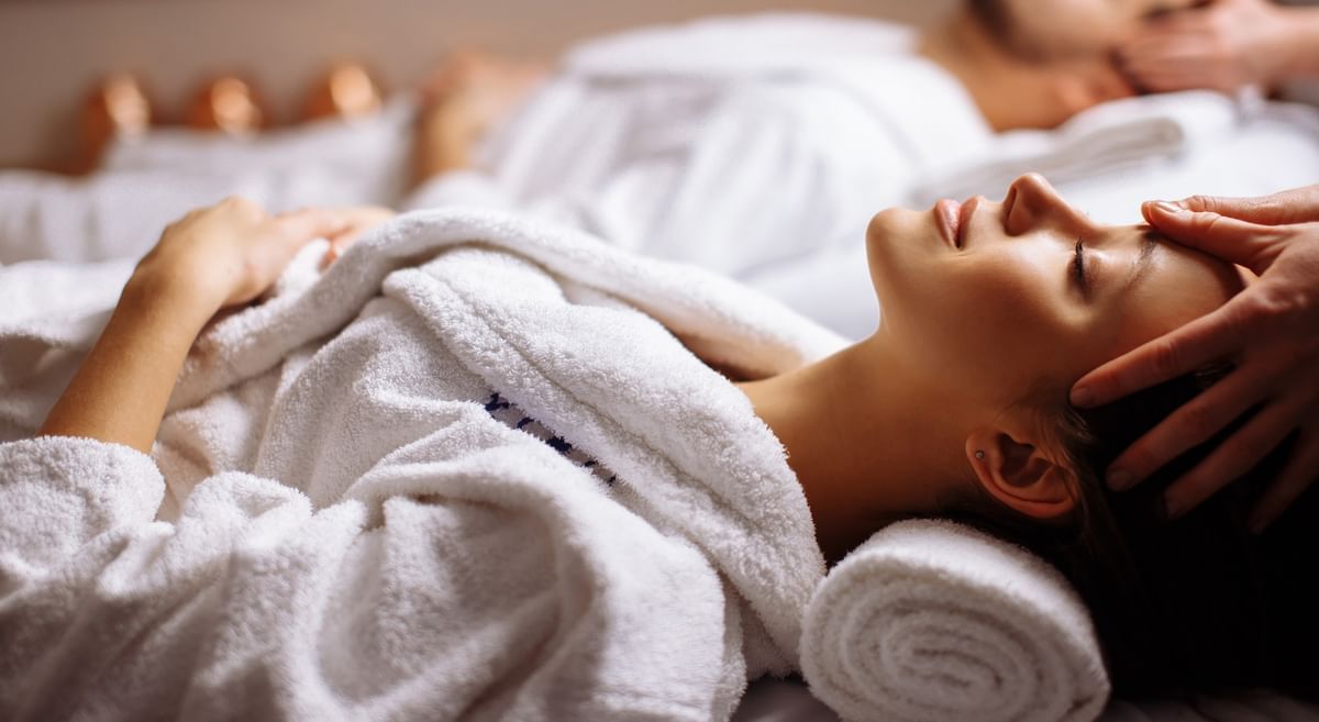 Couple receiving a spa treatment at Warwick Allerton Chicago