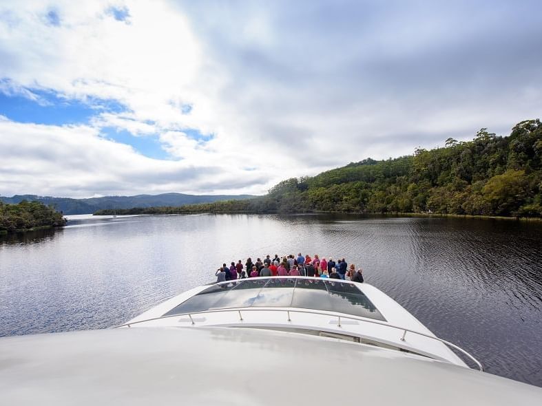 People watching the River from the ship near Strahan Village