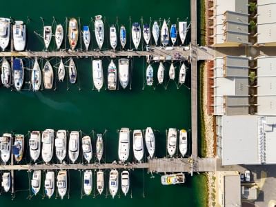 Aerial view of the boats docked by the pier near Be Fremantle