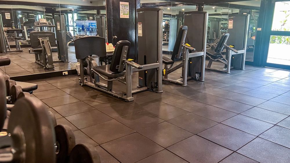 Modern fitness center with weight machines and free weights at Tokatoka Resort Nadi Fiji International Airport.