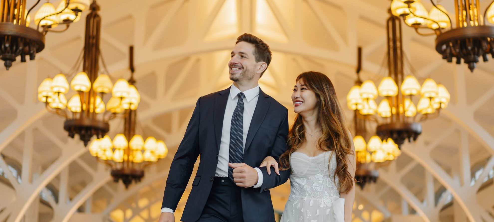 Couple holding hands in a wedding ceremony at The Fullerton Bay Singapore