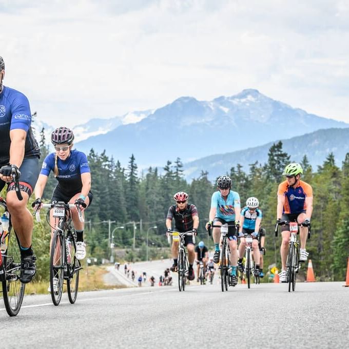 Cyclists riding for RBC GranFondo Whistler near Blackcomb Springs Suites