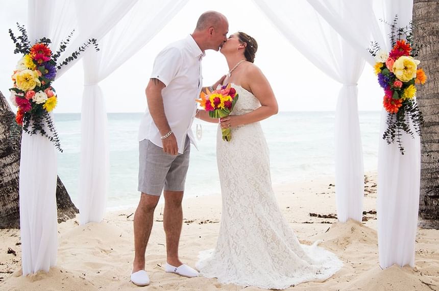 Couple kissing by the beach near Sugar Bay Barbados