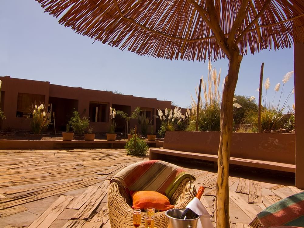 calm outdoor wine & lounge area at NOI Casa Atacama Hotel