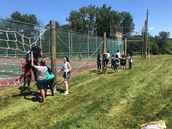 People at a Ropes course ground at Honor’s Haven Retreat